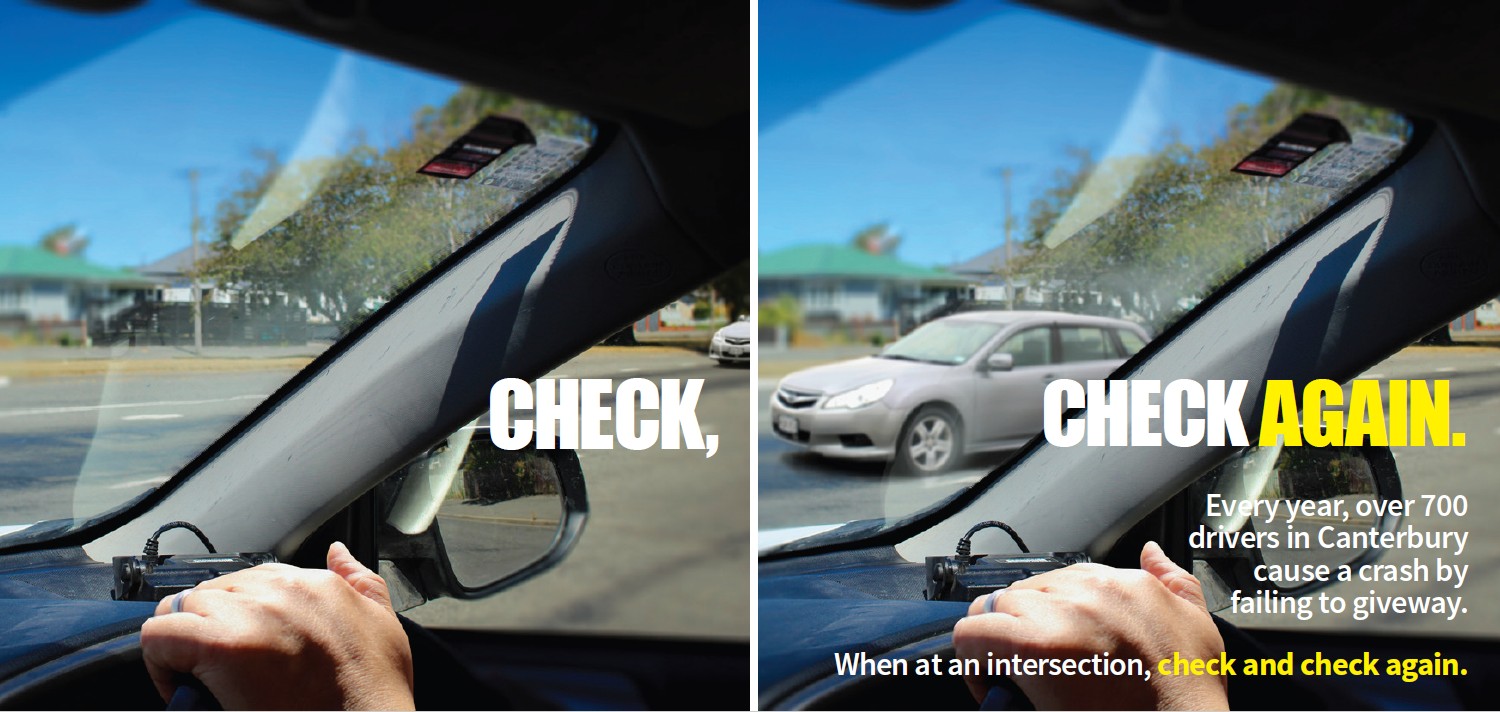 View of intersection taken from inside car cabin looking out windscreen and side window
